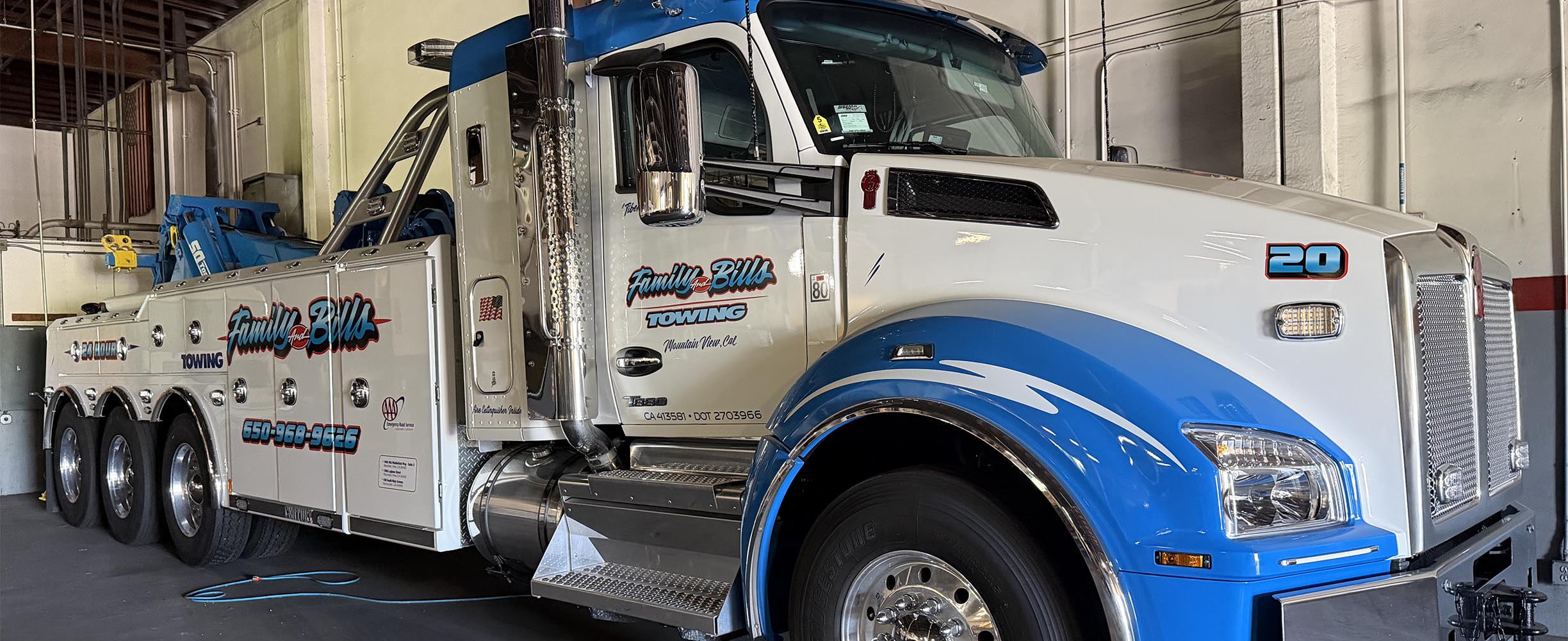 Heavy duty towing truck with 4 axels, virtually anything of any size and weight vehicle or machine.